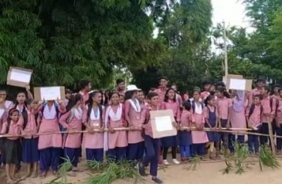School students blocked road in protest against deplorable condition of Kathaltali-Jharjhari road in North District School students blocked road in protest against deplorable condition of Kathaltali-Jharjhari road in North District